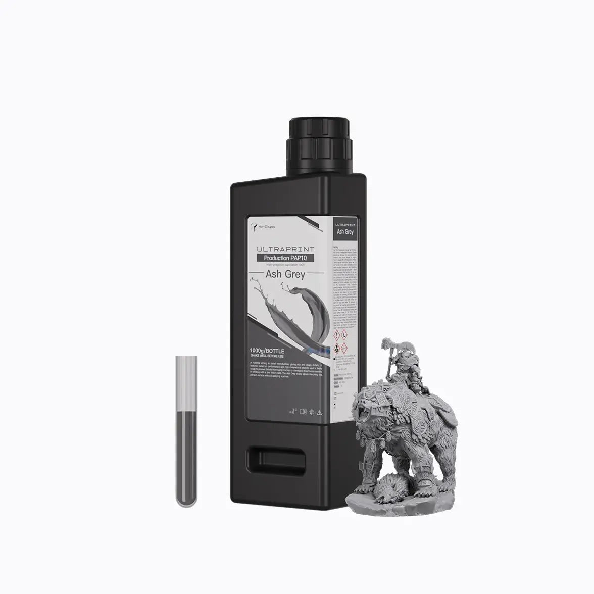 Botella de 1 kg de resina HeyGears UltraPrint PAP10 gris ceniza junto a una miniatura impresa